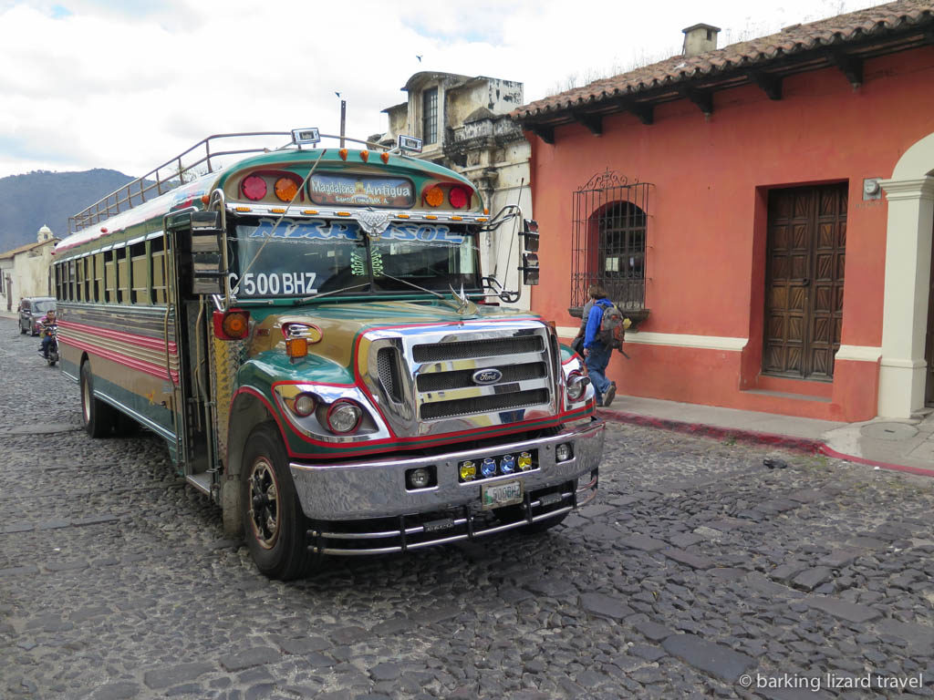 a 'chicken bus' driving through the streets of antigua guatemala