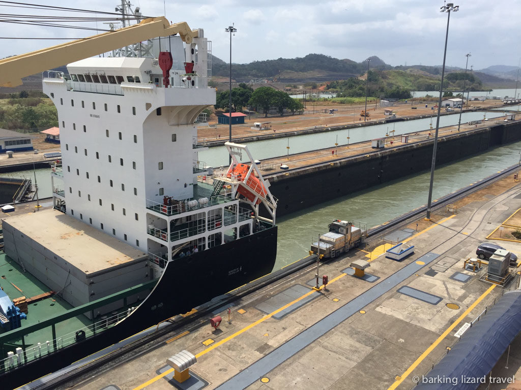 a boat going through the panama canal at the miraflores locks