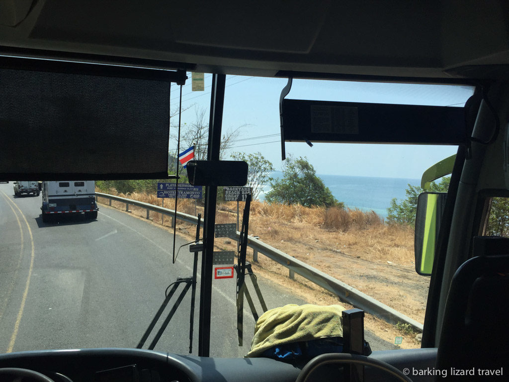 view from the front window of a bus travelling along the Costanera Sur