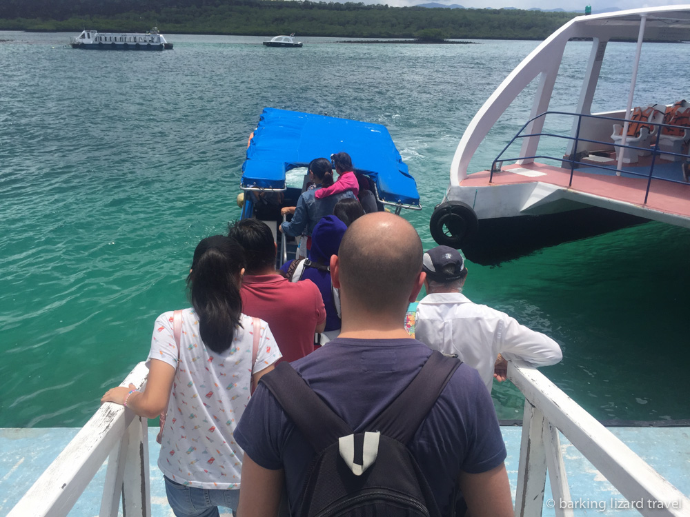 people boarding a lancha in Baltra to travel to Santa Cruz