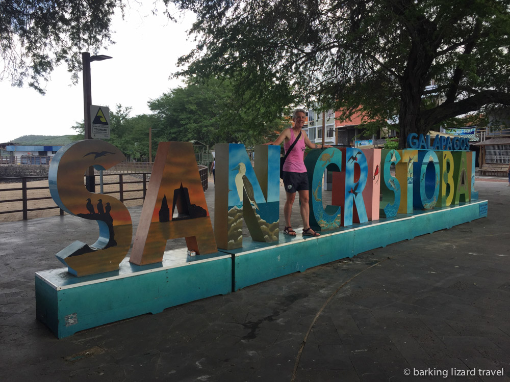 a photo of lydia standing on the san cristobal sign