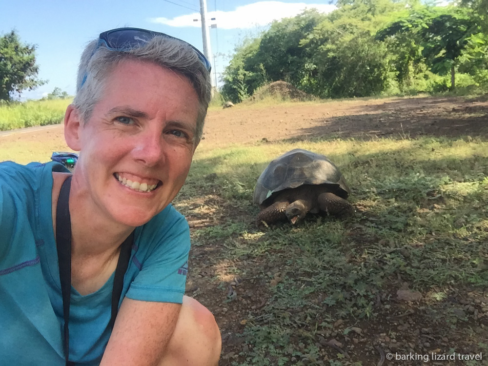 lydia taking a selfie with a giant tortoise in santa cruz