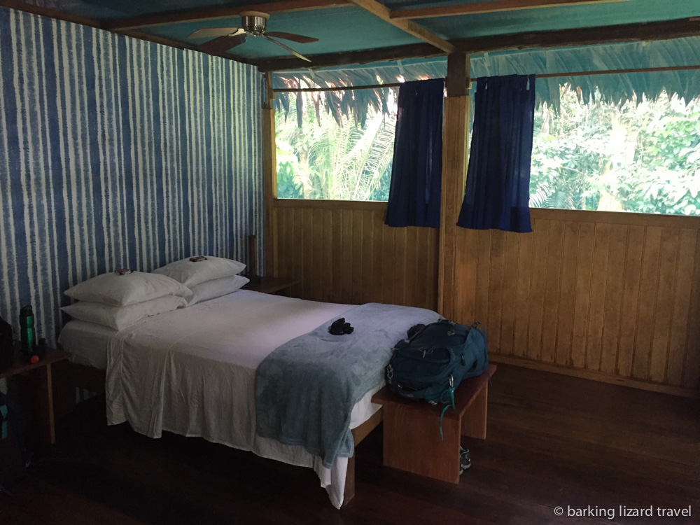 Photo of double bed in a Muyuna Amazon Lodge room