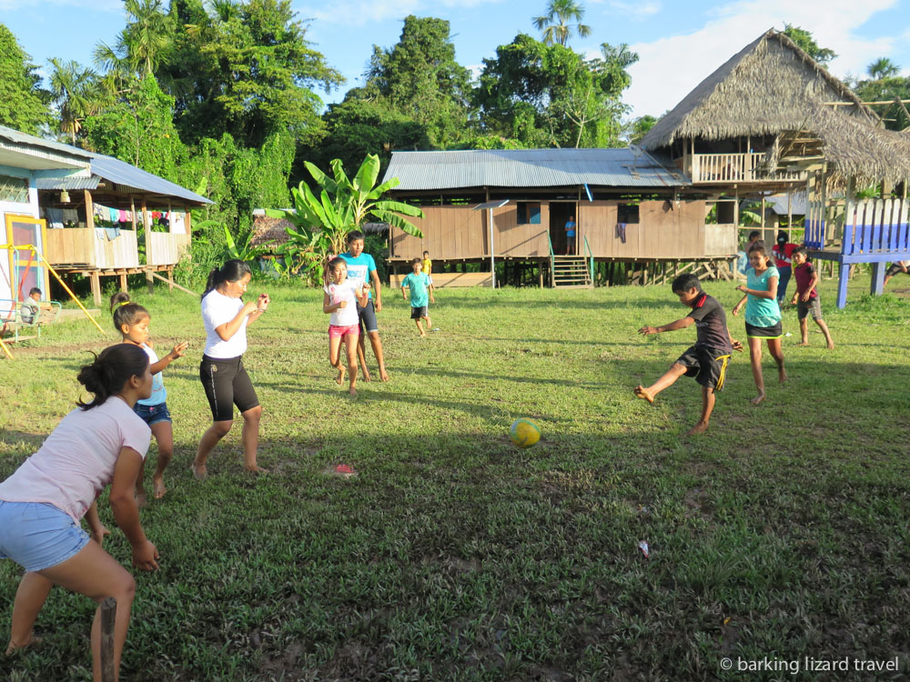 A photo of villagers playing a game of football in the Peruvian Amazon rainforest