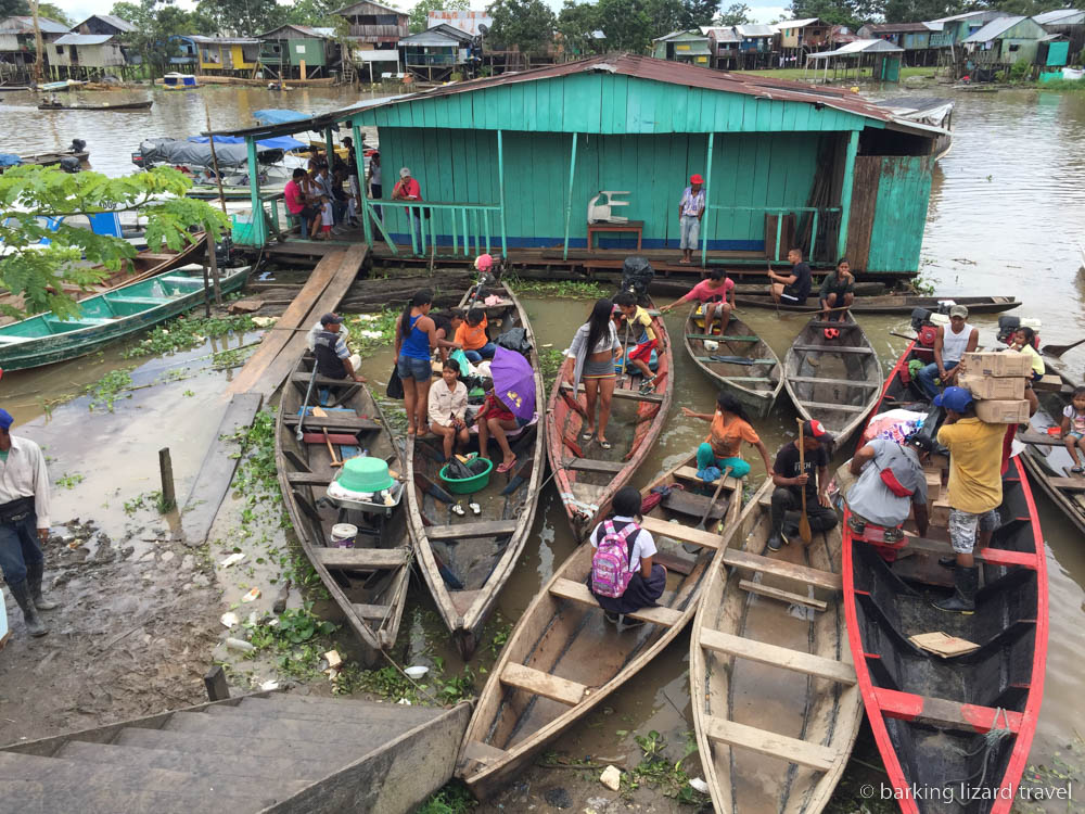 An image of people in small wooden boats on the Amazon river in Leticia
