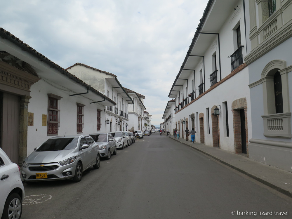 Photo of a street with white washed colonial buildings in Popayan.