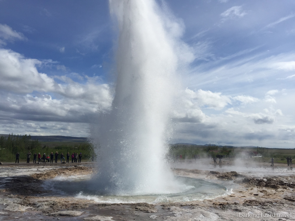 photo of a geysir shooting water into the air