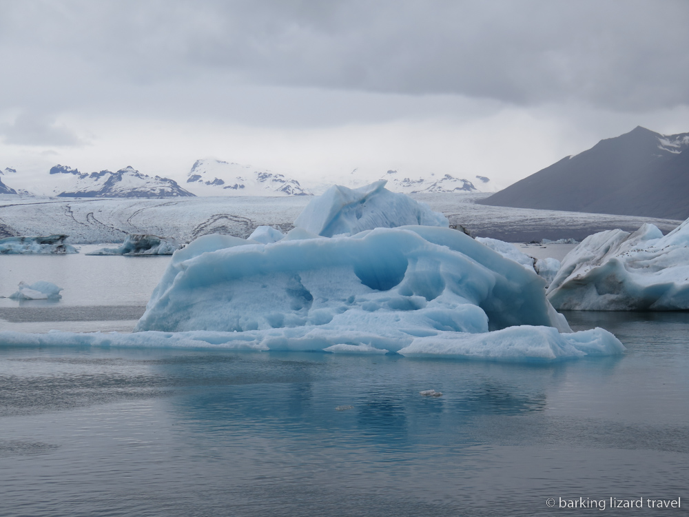 photo of a blue tinged iceberg in Jökulsárlón lagoon